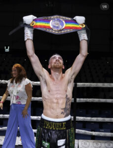 matthew machale with super flyweight commonwealth belt