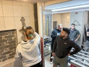 student grouting wall with epoxy grout